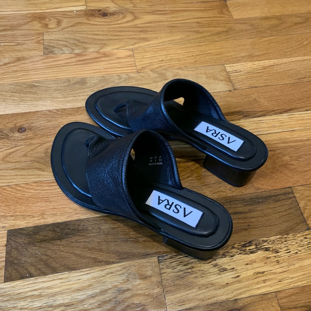 Black toe thong mules with a low heel